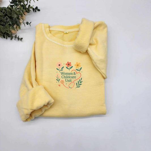 Women & Childcare Unit flowers and stethoscope vintage sweater