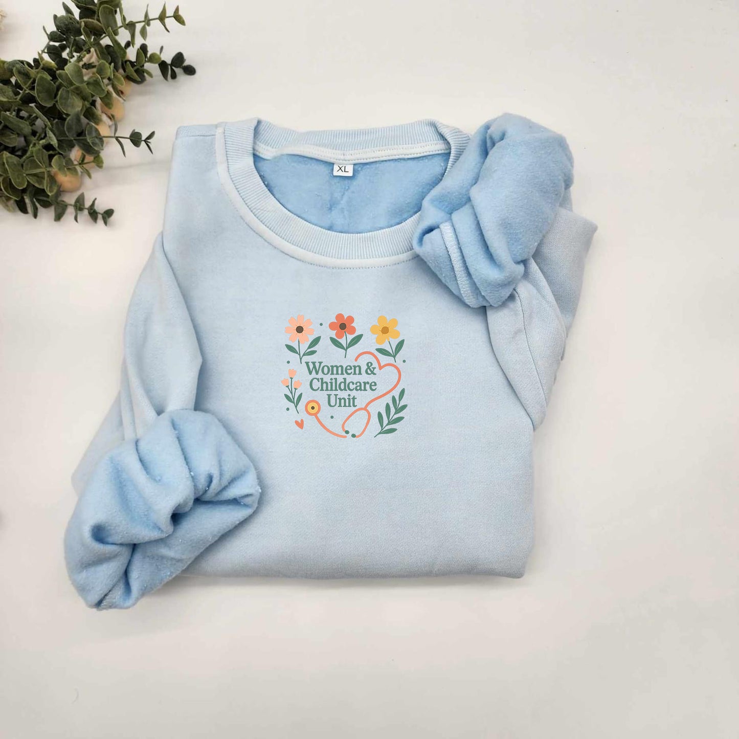 Women & Childcare Unit flowers and stethoscope vintage sweater